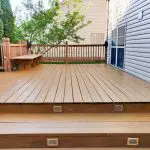 Stained wood deck with railing and built-in bench in a Northern Virginia backyard
