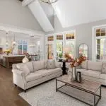 Open floor plan living room with a view through to the kitchen and dining area